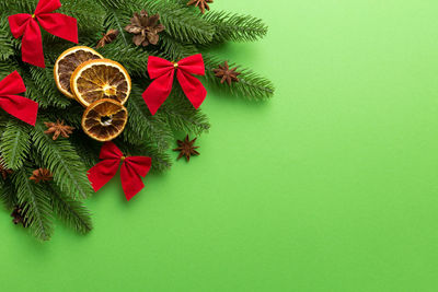 Directly above shot of christmas decorations on red background