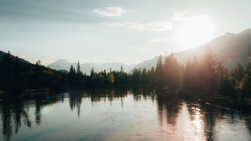 Scenic view of lake against sky at sunset