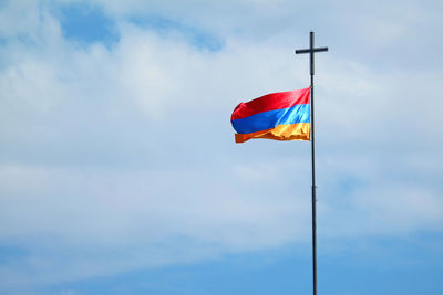 Low angle view of flag against sky