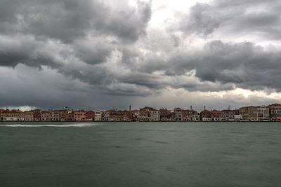 Scenic view of sea against cloudy sky