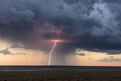 Thunderstorm lightning at sunset near vaughn, new mexico