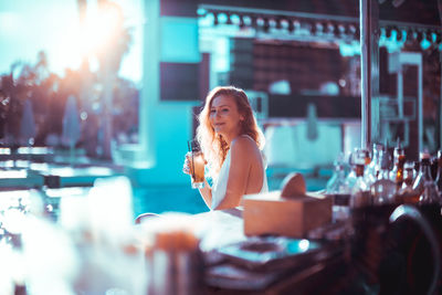 Young woman sitting at cafe