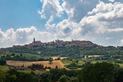 Built structure on landscape against sky