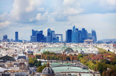 Modern buildings in city against sky