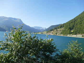 Scenic view of mountains against clear blue sky