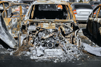 Destroyed engine and under the hood space of burned car. arson of a vehicle. insurance case.
