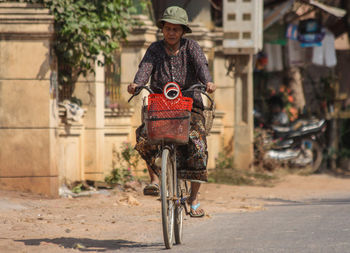 Man riding bicycle in city