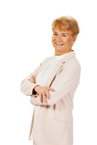 Portrait of a smiling young woman over white background