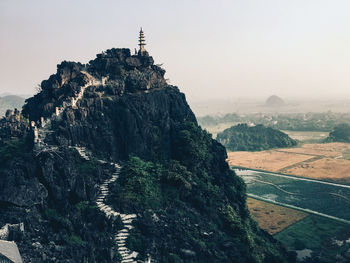 Rock formations on landscape against sky