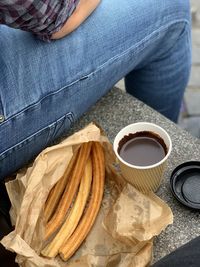 Midsection of woman with coffee