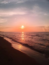 View of calm beach at sunset