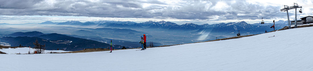 Scenic view of snowcapped mountains against sky