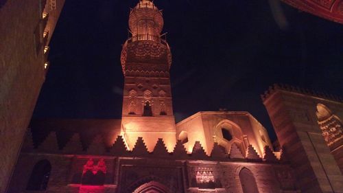 Low angle view of illuminated building at night