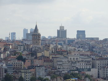 Buildings in city against sky