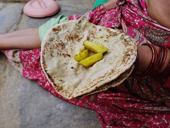 High angle view of woman holding food