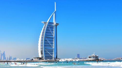 Ship in sea against blue sky