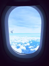 Low angle view of airplane flying in sky