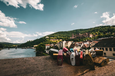 View of town by sea against sky