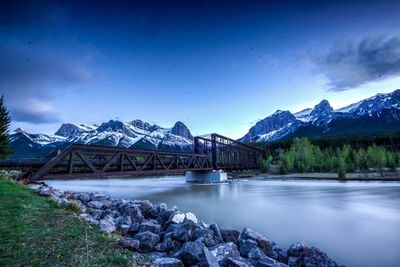 Panoramic view of bridge over river against sky at sunset