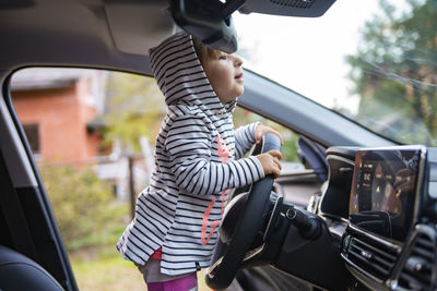 Rear view of woman in car