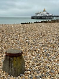 View of stone wall with sea in background