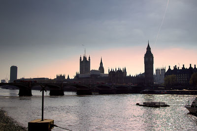 View of buildings in city at sunset