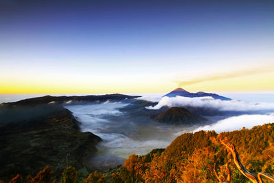 Scenic view of volcanic landscape against sky during sunset