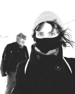 Portrait of two people in snow