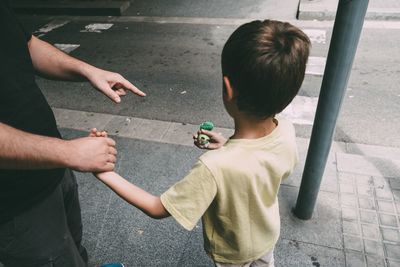High angle view of father and son on street