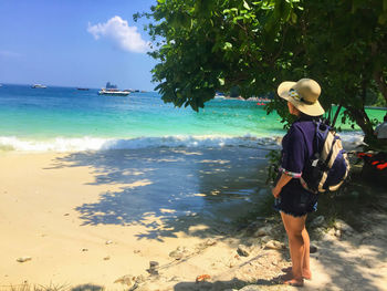 Rear view of man looking at sea