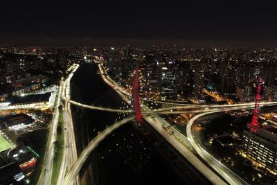 High angle view of light trails on highway at night