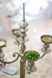 Close-up of candlestick holder on table