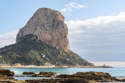 Peñon de ifach in calpe, on a morning with sun and clouds.
