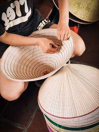 Midsection of woman wearing hat