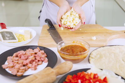 Midsection of man preparing food