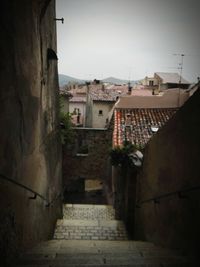 Houses in town against sky