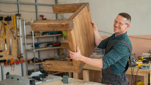 Portrait of man working in workshop
