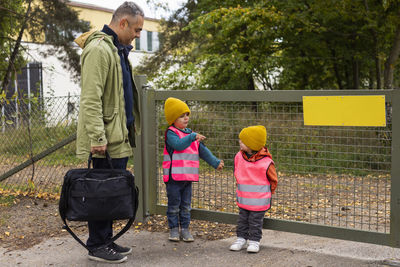 Father collecting children from school