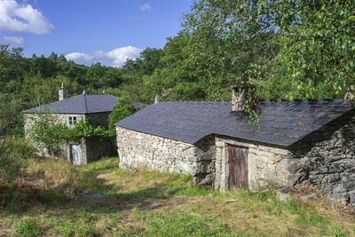 House on field against sky