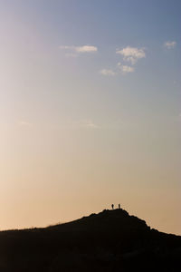 Scenic view of silhouette land against sky during sunset