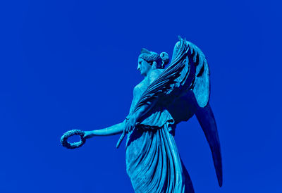 Low angle view of water against blue sky
