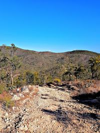 View of landscape against clear blue sky