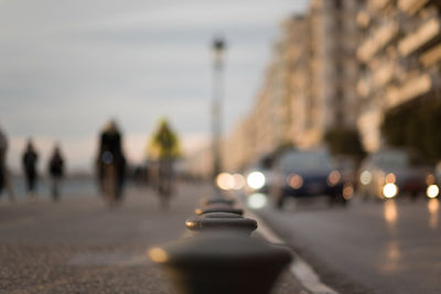 Bollards in row against buildings