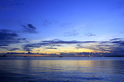 Scenic view of sea against sky at sunset