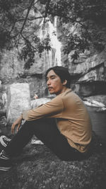 Side view of young man looking away