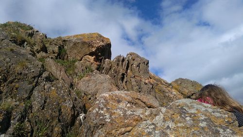 Low angle view of rock formation against sky