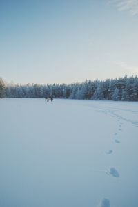 Scenic view of snow covered landscape against sky