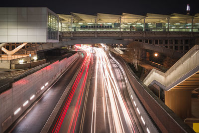 Blackfriars railway bridge and traffic light trails underneath in london at night