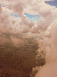 Aerial view of agricultural field against sky