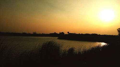 Scenic view of beach against sky during sunset